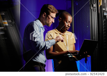 Network Technicians Using Laptop Network Technicians Using Laptop 92541420