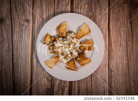 Oriental recipe aubergine and chickpea fatteh, pita, Greek yogurt, roasted pine nuts, zaatar 92541546