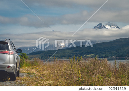 car for traveling with a mountain road 92541819