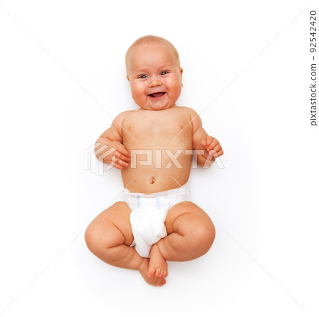 A tanned Caucasian baby in a white diaper laughs. Isolated on a white background 92542420