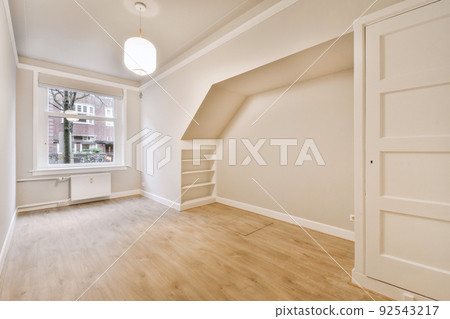 Plastic window and radiator on white wall in empty light room at home Plastic window and radiator on white wall in empty light room at home 92543217