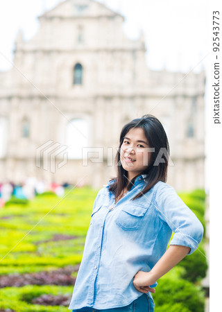 Asian tourist women travel in front of historic St.Paul Church architecture in macau city Asian tourist women travel in front of historic St.Paul Church architecture in macau city 92543773