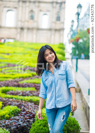 Asian tourist women travel in front of historic St.Paul Church architecture in macau city Asian tourist women travel in front of historic St.Paul Church architecture in macau city 92543776