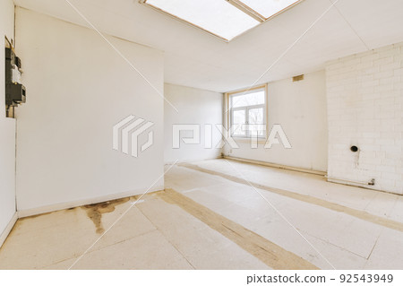 Plastic window and white wall in empty light room at home Plastic window and white wall in empty light room at home 92543949