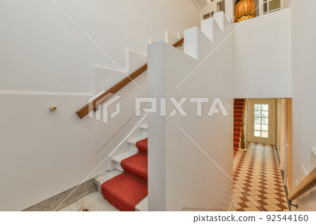 Luxury staircase hall of special design in an elegant house Luxury staircase hall of special design in an elegant house 92544160