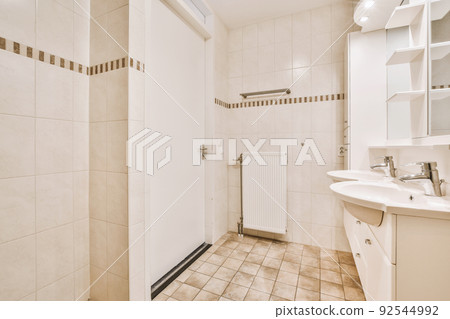 Interior of contemporary bathroom with shower, sink with toilet in minimal style in flat Interior of contemporary bathroom with shower, sink with toilet in minimal style in flat 92544992