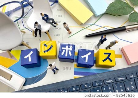 Businessmen considering the introduction of the invoice system Businessmen considering the introduction of the invoice system 92545636