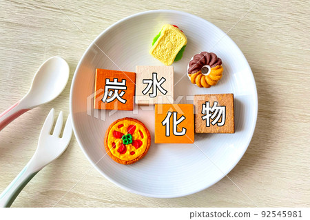 Carbohydrate bread, pizza, donuts on a plate Carbohydrate bread, pizza, donuts on a plate 92545981