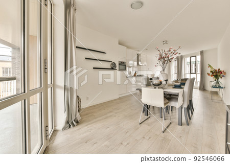 Spacious bright kitchen with dining area, modern design and panoramic windows 92546066