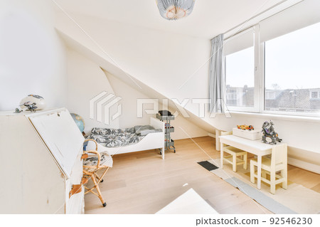 Interior of modern kid bedroom with bed and shelves with various toys at home 92546230