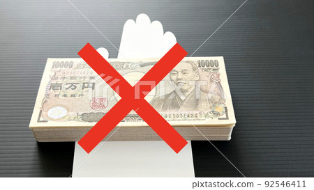 A wad of 10,000 yen bills on a white hand image and a cross A wad of 10,000 yen bills on a white hand image and a cross 92546411