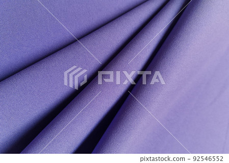 Violet crumpled or wavy fabric texture background. Abstract linen cloth soft waves. Gabardine wool fabric. Merino yarn. Smooth elegant luxury cloth texture. Concept for banner or advertisement. Violet crumpled or wavy fabric texture background. Abstract linen cloth soft waves. Gabardine wool fabric. Merino yarn. Smooth elegant luxury cloth texture. Concept for banner or advertisement. 92546552