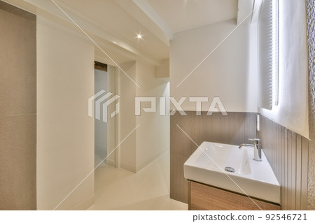 Interior of contemporary bathroom with shower and marble walls in minimal style flat 92546721