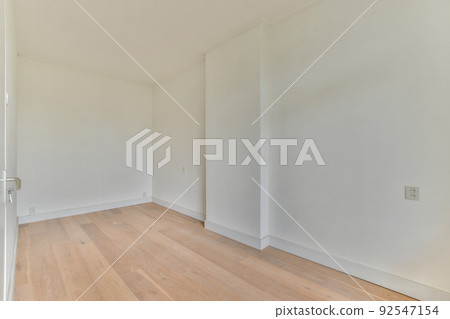 Interior of empty white room with large balcony windows with curtains and wooden parquet floor Interior of empty white room with large balcony windows with curtains and wooden parquet floor 92547154
