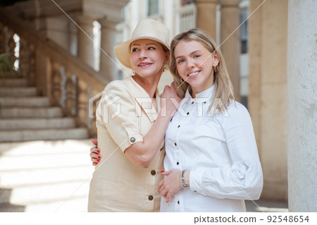 Female tourist enjoying the photo shoot with her mother Female tourist enjoying the photo shoot with her mother 92548654