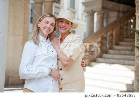 Female hugging her mother during the photo shoot 92548655