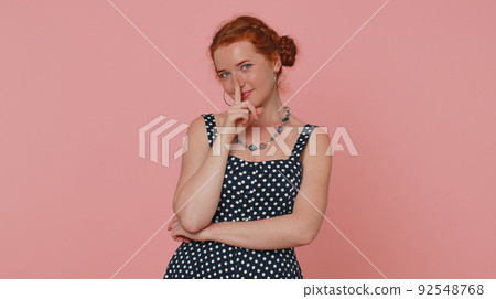 Girl presses index finger to lips makes silence gesture sign do not tells secret, shh be quiet Girl presses index finger to lips makes silence gesture sign do not tells secret, shh be quiet 92548768