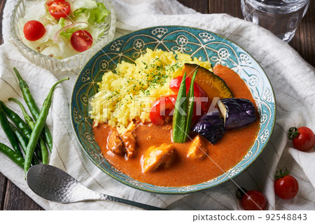 Spicy curry with summer vegetables and chicken Spicy curry with summer vegetables and chicken 92548843