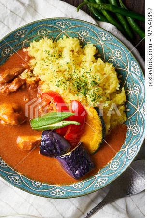 Spicy curry with summer vegetables and chicken 92548852