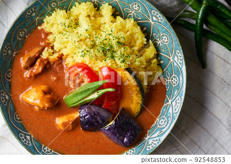 Spicy curry with summer vegetables and chicken Spicy curry with summer vegetables and chicken 92548853