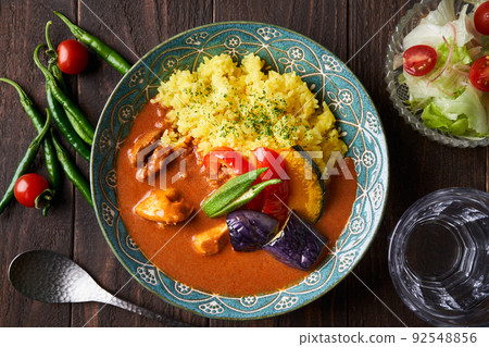 Spicy curry with summer vegetables and chicken Spicy curry with summer vegetables and chicken 92548856