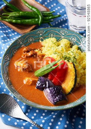 Spicy curry with summer vegetables and chicken Spicy curry with summer vegetables and chicken 92548865