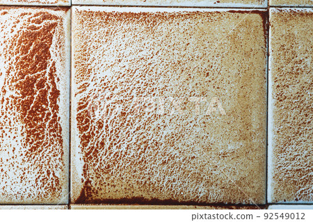 abstract wet rust scattering on a tile background 92549012