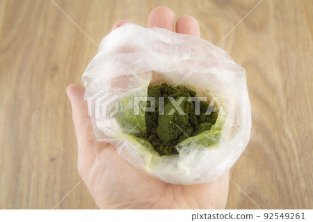 carcinogenic chewing tobacco powder (nas, nasvay, dip, snus) from Tajikistan, in a bag in a person's hand, blur effect carcinogenic chewing tobacco powder (nas, nasvay, dip, snus) from Tajikistan, in a bag in a person's hand, blur effect 92549261