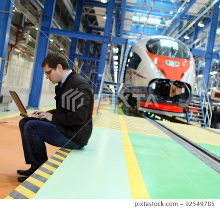 engeneer making his work in the service depot engeneer making his work in the service depot 92549785