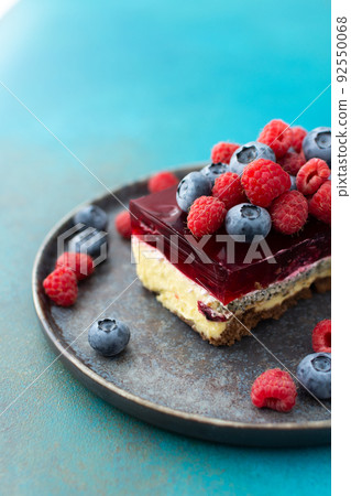 Piece of cheesecake with fruits Piece of cheesecake with fruits 92550068