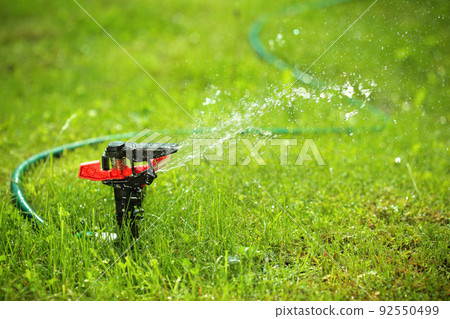 closeup of lawn sprinkler with copyspace closeup of lawn sprinkler with copyspace 92550499