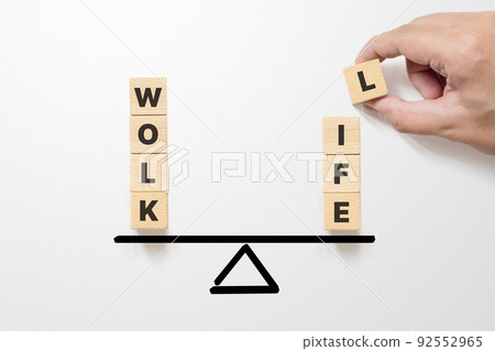 Work life balance concept. Wooden cube block with word WORK and LIFE on seesaw 92552965