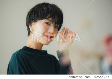 A woman in a dark green knit 92554253