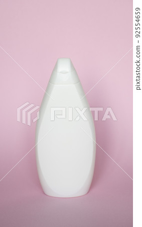 White plastic soap shampoo bottle isolated on pink background. Skin care lotion. Bathing essential product. Shampoo bottle. Bath and body lotion. Fine liquid hand wash. Bathroom accessories. White plastic soap shampoo bottle isolated on pink background. Skin care lotion. Bathing essential product. Shampoo bottle. Bath and body lotion. Fine liquid hand wash. Bathroom accessories. 92554659