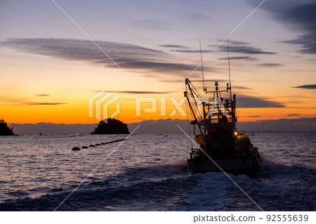 A fisherman in Ishinomaki City, Miyagi Prefecture, heads for an oyster farming job 92555639