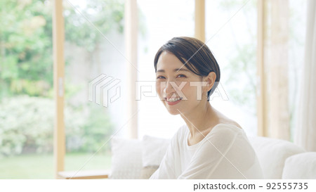 A smiling middle woman 92555735