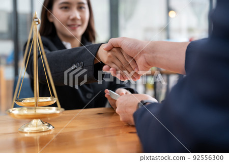 Business people shake hands after legal consultation from a lawyer. Business people shake hands after legal consultation from a lawyer. 92556300