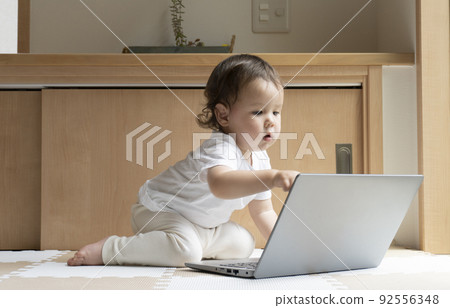 Half boy operating the PC in front of me Half boy operating the PC in front of me 92556348
