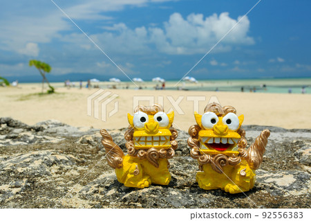 Okinawa's blue sea and shisa 92556383