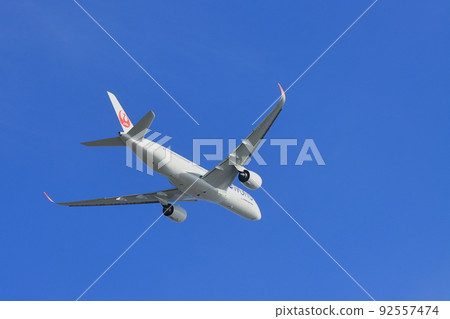 Passenger planes taking off and climbing Passenger planes taking off and climbing 92557474