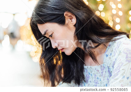 Beautiful Asian woman smiling with bokeh background. Beautiful Asian woman smiling with bokeh background. 92558085