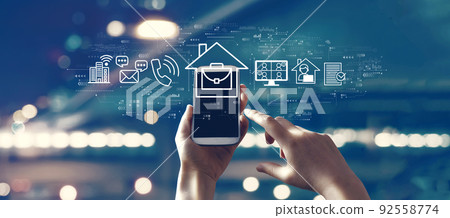 Telework theme with person using smartphone 92558774