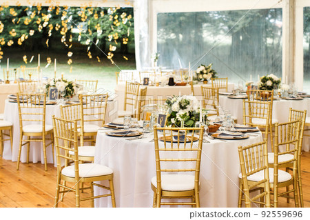 Tables sets for wedding or another catered event dinner Tables sets for wedding or another catered event dinner 92559696