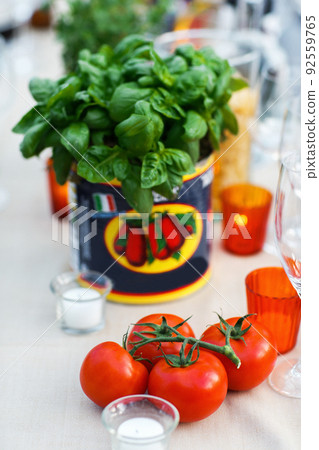 Candles and tomatoes on the wedding table Candles and tomatoes on the wedding table 92559765