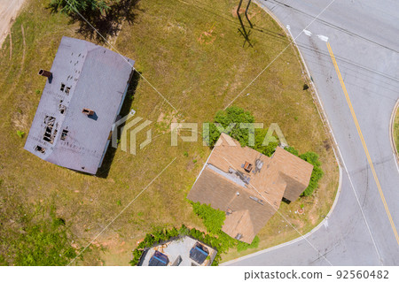 Roofing construction site the removal of gray asphalt roof damaged Roofing construction site the removal of gray asphalt roof damaged 92560482