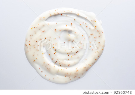 A sample of a hand scrub based on jojoba oil. Cosmetic product for moisturizing and cleansing the skin 92560748