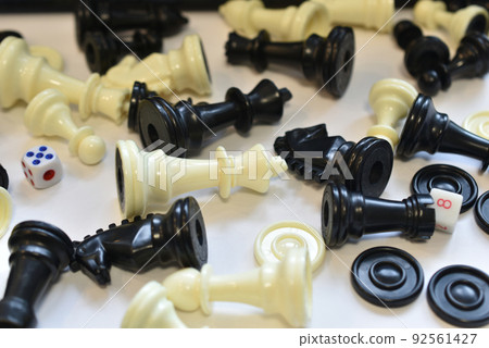 Chess pieces lie randomly on the table. Chess pieces lie randomly on the table. 92561427