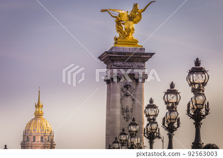 Street lights and Invalides in Pont Alexandre III, Paris, france Street lights and Invalides in Pont Alexandre III, Paris, france 92563003
