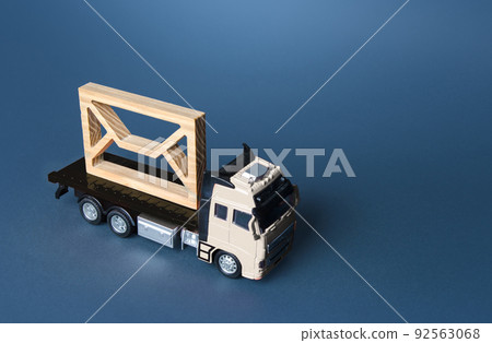 Truck is carrying an big envelope. Digitalization of bureaucracy. Correspondence. Communication, e-mail newsletter. Security and confidentiality. Sending price lists and special offers for customers. 92563068