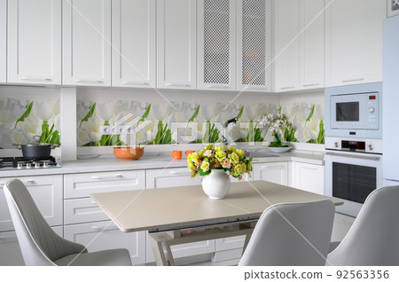 Modern luxurious kitchen and dining room Modern luxurious kitchen and dining room 92563356